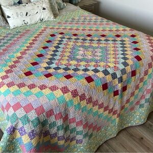 Adorable vintage patchwork around the world quilt all hand stitched!